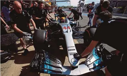  ?? REUTERS PIC ?? Mercedes’ Lewis Hamilton arrives in the pits during first practice for the Spanish Grand Prix at the Circuit de Catalunya in Montmelo yesterday.