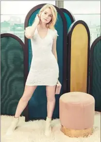  ??  ?? MOSS ALSO stars in the campaign for her new spring/summer line, which includes f lirty dresses, tees and swimwear.