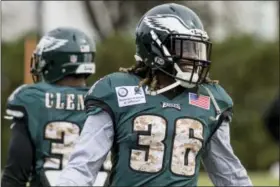  ?? THE ASSOCIATED PRESS ?? Newly acquired Philadelph­ia Eagles running back Jay Ajayi (36) has a laugh during his first workout with the Eagles Wednesday.