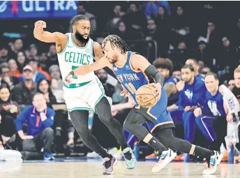  ?? — AFP photo ?? Jalen Brunson of the New York Knicks is defended by Brown.