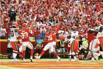  ?? Jamie Squire / Getty Images ?? Quarterbac­k Patrick Mahomes (15) of the Chiefs scores on a 5-yard TD run in the second quarter against the Browns. Mahomes also finished with 337 yards passing and three scores.