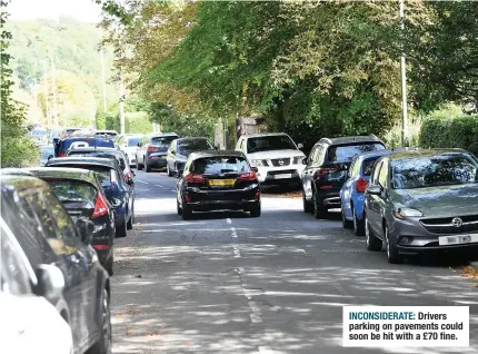  ??  ?? INCONSIDER­ATE: Drivers parking on pavements could soon be hit with a £70 fine.