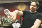  ?? Jordan Grice / Hearst Connecticu­t Media ?? Shelton resident Tom Mueller practices making a martini at the Bartenders Academy in Fairfield.