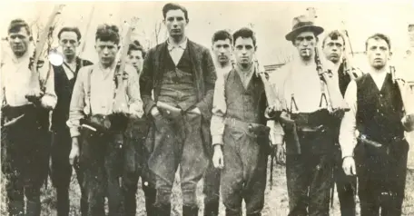  ??  ?? Volunteers: This Irish Military Archives photo shows members of East Cork Flying Column 1920-21: Michael Desmond (killed February 20, 1921), Paddy Higgins (captured at Clonmult; sentenced to death and released at the Truce), James Glavin (killed February 20), Donal Dennehy (killed February 20), Joseph Aherne (Vice-Commandant), Richard Hegarty (killed February 20), Joseph Morrissey (killed February 20), Michael Hollahan (killed February 20), M Moore (executed after arrest at Clonmult, February 20) and Paddy White (USA)