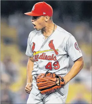  ?? AP PHOTO ?? St. Louis Cardinals relief pitcher Jordan Hicks celebrates as he strikes out Los Angeles Dodgers’ Chris Taylor to end the baseball game Wednesday, in Los Angeles.