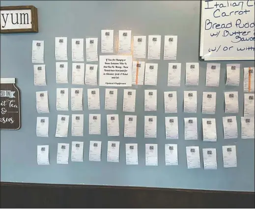  ?? (Courtesy Photo/Zack’s Cafe) ?? Receipts for pre-paid meals hang on the wall inside Zack’s Cafe in Miami, Okla. Customers pay for them so people in need, many of them struggling financiall­y due to the coronaviru­s pandemic, can get a meal, judgment-free and no questions asked.
