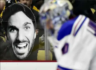  ?? Peter Diana/Post-Gazette ?? Penguins fans try to get Rangers goalie Henrik Lundqvist off his game early in Game 4 Wednesday night at Consol Energy Center.