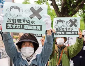  ??  ?? Flowing anger: People rallying in Tokyo to protest against the Japanese government’s decision to discharge contaminat­ed radioactiv­e wastewater in the Fukushima Prefecture into the sea. — Xinhua