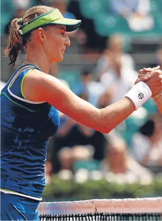  ?? Picture: Getty Images. ?? Top seed Angelique Kerber, right, shakes hands with her first round conqueror Ekaterina Makarova.