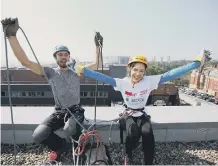  ??  ?? Phoebe Hedley with abseil instructor Ben Ritchie before she walked down the side of the RVI in Newcastle in 2016.