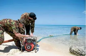  ?? NZDF ?? Lance Corporal Luke Bailey, Sapper Shane Olsen and Lance Corporal Hamish Gleeson-Long pump salt water into a reservoir for a desalinati­on unit during a water crisis in Tuvalu in 2011.