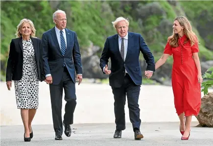  ?? AP ?? Britain’s Prime Minister Boris Johnson, his wife Carrie Johnson and US President Joe Biden with Dr Jill Biden walk outside Carbis Bay Hotel, Cornwall, Britain, ahead of the G7 summit.