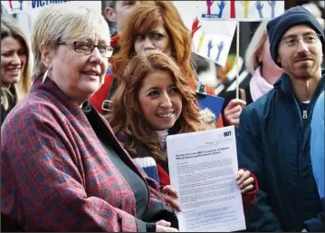  ??  ?? One out, all out: Julie Davies, left, with teachers who walked out over her suspension