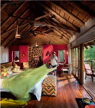  ?? ?? BELOW Vibrant colours add a dashingly contempora­ry atmosphere to the handsome stilted suites at Jaci’s Tree Lodge.