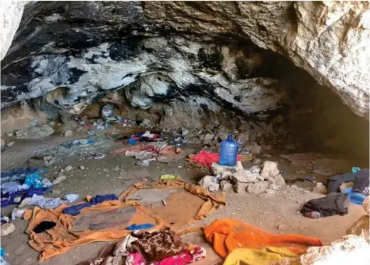  ??  ?? hideout: Bedding, waste and water bottles litter the cave in crete where 112 migrants were kept en route to UK by smugglers