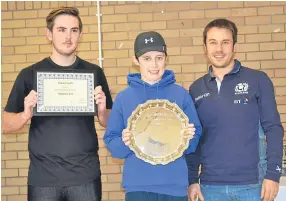  ??  ?? Montrose won the Junior Tennis League Division One title. From left — Owen Flight and Orin Forbes. Robin Nisbet (right) presented the award.