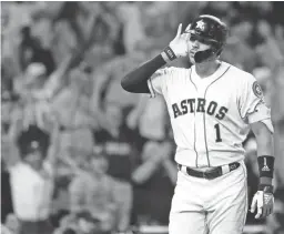  ?? MATT SLOCUM/AP ?? Astros shortstop Carlos Correa celebrates after his walk-off home run in the 11th inning against the Yankees in Game 2 of the ALCS on Sunday.