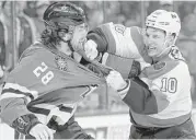  ?? Tom Mihalek / Associated Press ?? When Philadelph­ia’s Brayden Schenn, right, wasn’t trading punches with Dallas’ Stephen Johns, he was scoring three goals in the Flyers’ 4-2 win Saturday.