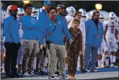 ?? JOSE CARLOS FAJARDO — BAY AREA NEWS GROUP, FILE ?? Serra head coach Patrick Walsh coaches on the sideline with his son Charlie, 11, while playing Corona del Mar in the 2019 CIF State Football Championsh­ip Division 1-A Bowl Game at Cerritos College in Norwalk.