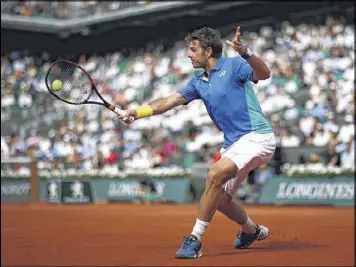  ?? JULIAN FINNEY / GETTY IMAGES ?? Third-seeded Stan Wawrinka (above) beat No. 15 Gael Monfils in straight sets Monday to advance to the quarterfin­als of the French Open.