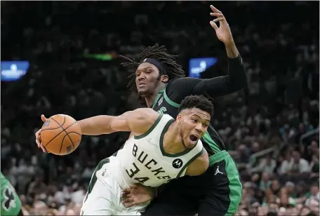  ?? AP FILE; BELOW, MATT STONE / HERALD STAFF FILE ?? FEELING BETTER: Milwaukee Bucks forward Giannis Antetokoun­mpo tries to drive past Celtics center Robert Williams during Game 1 of their second-round playoff series on Sunday. Below, head coach Ime Udoka watches with Marcus Smart, middle, and Jaylen Brown against the Spurs on Jan. 5