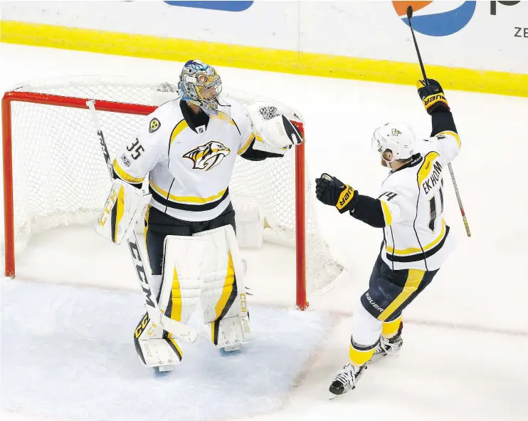  ?? — THE ASSOCIATED PRESS ?? Nashville Predators goalie Pekka Rinne and blue-liner Mattias Ekholm celebrate after defeating the Blues 4-3 in Game 1 on Wednesday in St. Louis.