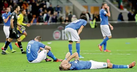  ?? AP ?? Italian players react to their side’s eliminatio­n in the World Cup qualifying play-off second leg football match against Sweden at the Milan San Siro stadium, Italy on Monday. The match ended in a goalless draw but Sweden qualified with a 1-0 aggregate...