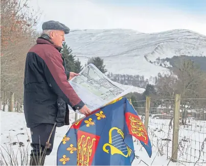  ??  ?? Historic significan­ce: James Rattray with the plan of the A9 at the Killiecran­kie battlefiel­d site.