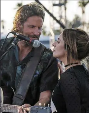  ?? AStarIsBor­n. ?? Bradley Cooper as Jackson and Lady Gaga as Ally in