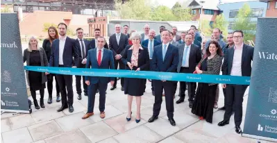  ?? ?? Countrysid­e opened the new fountain and public square in St Ives Road, with MP Theresa May cutting the ribbon. Ref:134456-7