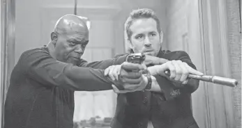  ?? JACK ENGLISH ?? Samuel L. Jackson, Ryan Reynolds and The Hitman’s Bodyguard racked up $21.6M and No. 1.