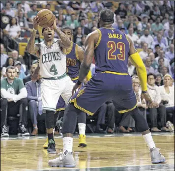  ?? CHARLES KRUPA / AP ?? The Celtics’ Isaiah Thomas challenges LeBron James on Wednesday night in Game 1 of the Eastern Conference finals. James outscored Thomas 38-17.