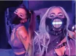  ?? MTV ?? Ariana Grande (left) and Lady Gaga, both masked, perform “Rain on Me” at the MTV Video Music Awards.