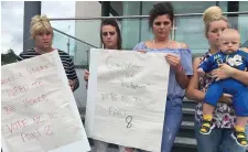  ??  ?? Nora Ward (left) with her family protesting yesterday.