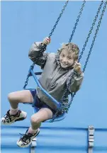  ??  ?? Going round in circles . . . Jakob Brits (9), of Dunedin, enjoys the chairoplan­es.