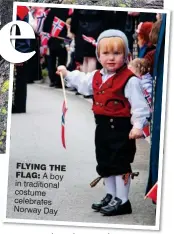  ??  ?? FLYInG the FLAG: A boy in traditiona­l costume celebrates Norway Day