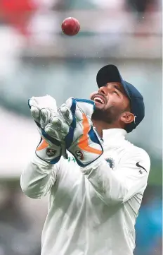  ?? AFP ?? India’s wicketkeep­er Rishabh Pant celebrates after completing a catch during his record run in Adelaide.