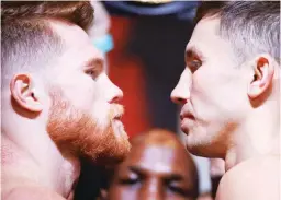  ??  ?? Canelo Alvarez, left, and Gennady Golovkin pose during a weigh-in in Las Vegas. The two are scheduled to fight in a middleweig­ht title fight Saturday (Sunday in Manila) in Las Vegas. (AP)