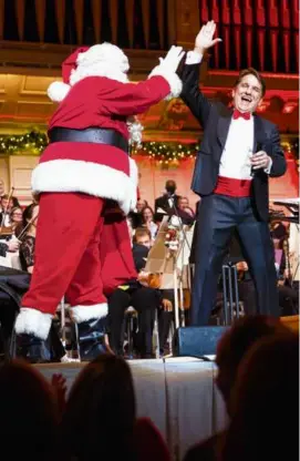  ?? HILARY SCOTT ?? Keith Lockhart with Santa at a 2022 Holiday Pops show.