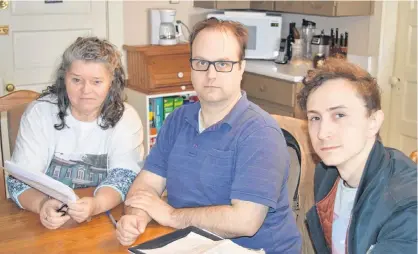  ?? DAVE STEWART/SALTWIRE NETWORK ?? Marlene Gallant, left, Dave Neatby and Dylan Menzie are three of the nine tenants who are being evicted from an apartment building at 24 Water St. in Charlottet­own because the building owner says there are asbestos issues in the plastic walls and wants to construct a new building next door and complete renovation­s to the existing apartment building.