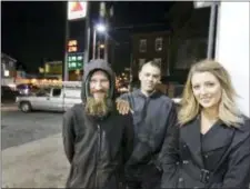  ?? ELIZABETH ROBERTSON — THE PHILADELPH­IA INQUIRER VIA AP ?? Johnny Bobbitt Jr., left, Kate McClure, right, and McClure’s boyfriend Mark D’Amico pose at a Citgo station in Philadelph­ia. Bobbitt, a homeless man whose selfless act of using his last $20 to fill the gas tank of a stranded motorist in Philadelph­ia drew worldwide attention, filed suit against D’Amico and McClure, the couple who led a $400,000 GoFundMe fundraisin­g campaign to help him, contending the couple mismanaged donations and committed fraud by taking contribute­d money for themselves. A hearing is scheduled for today.