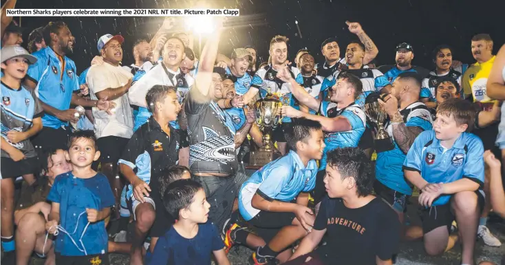  ??  ?? Northern Sharks players celebrate winning the 2021 NRL NT title. Picture: Patch Clapp