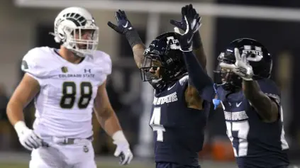  ?? Eli Lucero, The Herald Journal ?? Utah State’s Shaq Bond and Hunter Reynolds celebrate after CSU’S Cayden Camper missed a potential game-winning field goal with one second remaining on Friday.