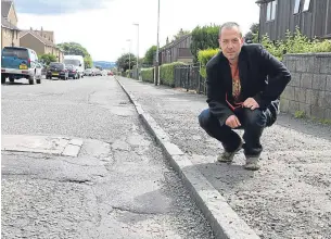  ??  ?? Scott Murphy is also unhappy with the state of the road surface.