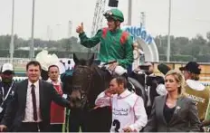  ?? Atiq-ur-Rehman/Gulf News ?? Jockey Christophe Soumillon celebrates aboard Vazirabad after winning the Dubai Gold Cup yesterday.