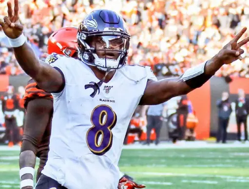  ?? Associated Press ?? Lamar Jackson celebrates a 12-yard touchdown pass to running back Mark Ingram in a 31-15 win at Cleveland Dec. 22. The favorite to win the NFL’s Most Valuable Player award, Jackson threw for 36 touchdowns against only six intercepti­ons in the regular season.