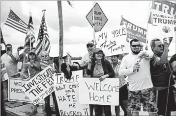  ?? CAROLYN KASTER/AP ?? A crowd of mostly supporters of President Donald Trump lines the route of the president’s motorcade Saturday in Florida.