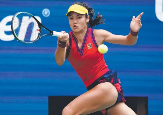  ??  ?? Britain’s Emma Raducanu hits a return to American Shelby Rogers in their US Open fourth-round match on Tuesday. Picture: AFP