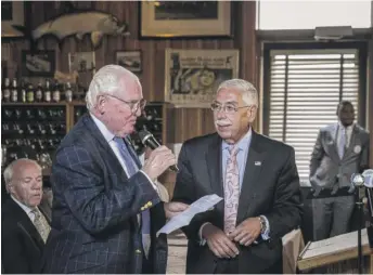  ?? RICH HEIN/SUN-TIMES ?? Ald. Ed Burke (left) and then-Cook County Assessor Joe Berrios at a 2017 Cook County Democratic Party slatemakin­g session at the Erie Cafe.