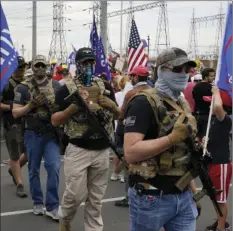  ?? AP PHOTO/ROSS D FRANKLIN ?? Supporters of President Donald Trump rally outside the Maricopa County Recorder’s Office, Friday, in Phoenix.